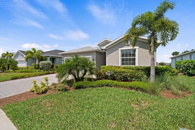 ranch-style house with a front lawn