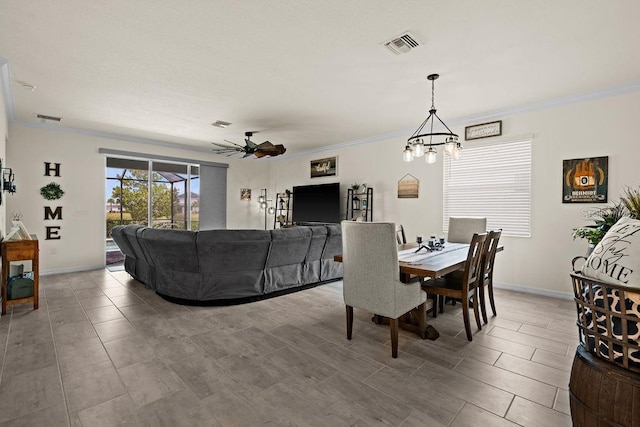 dining area with ceiling fan with notable chandelier and ornamental molding