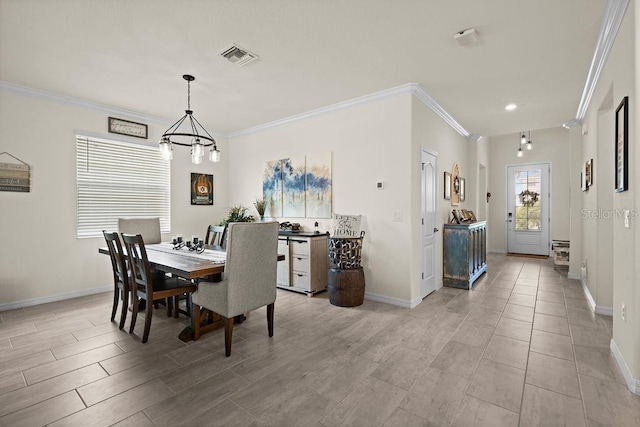 dining room with an inviting chandelier and ornamental molding