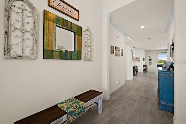 hallway featuring crown molding