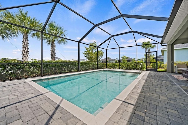 view of pool featuring a lanai and a patio