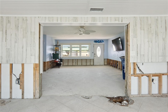 interior space featuring ceiling fan