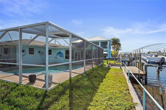 exterior space with glass enclosure and a water view