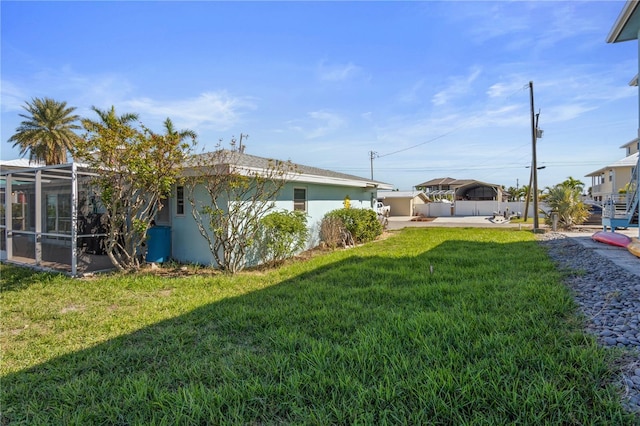 view of yard featuring a lanai and a patio