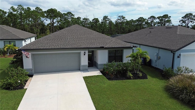 ranch-style house featuring a garage and a front lawn