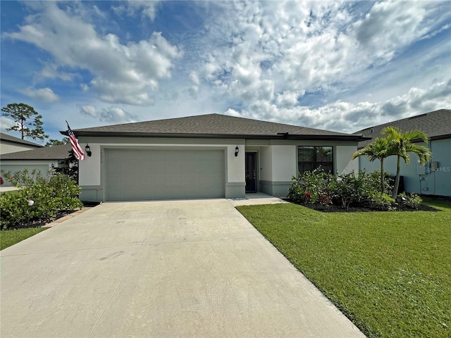 view of front of house featuring a front lawn and a garage