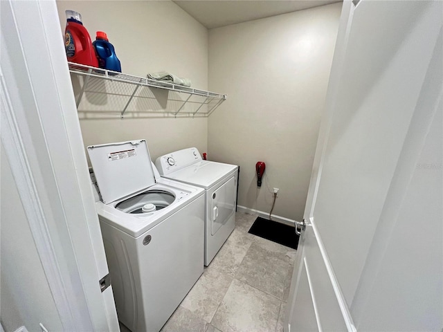 washroom with washer and dryer