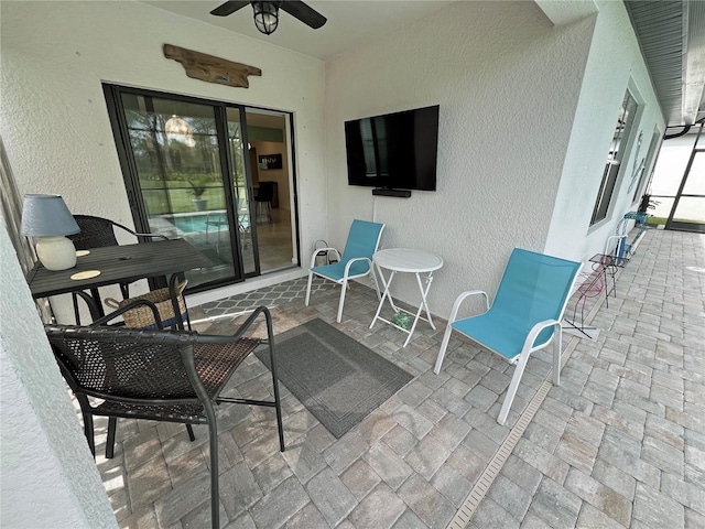 view of patio with ceiling fan