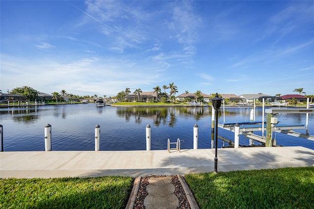 view of dock with a residential view, a water view, and boat lift