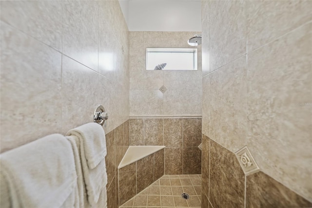 bathroom with a tile shower