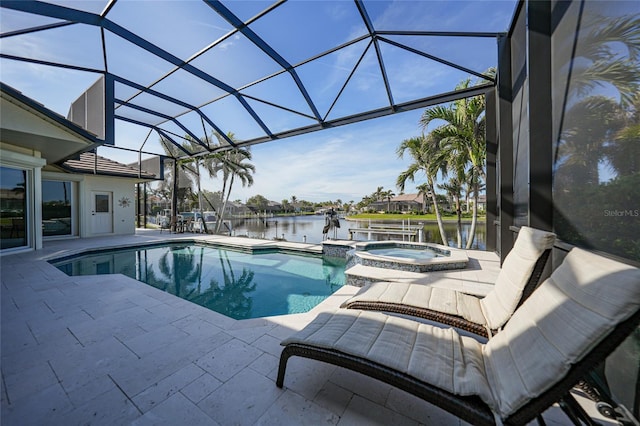 view of swimming pool featuring a patio area, a water view, a lanai, and a pool with connected hot tub