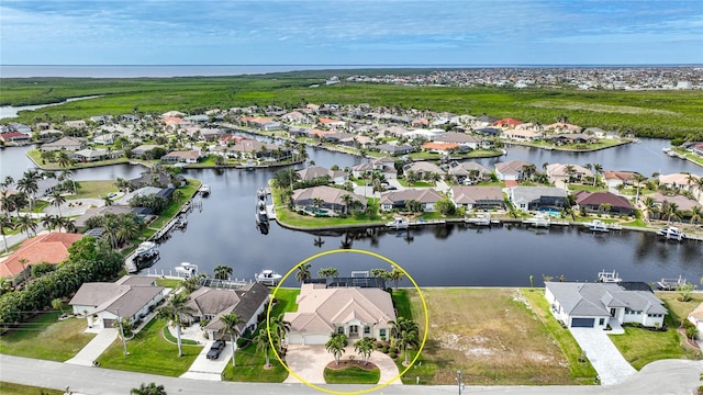 aerial view featuring a water view and a residential view