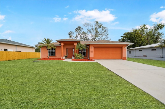 view of front of home featuring a garage and a front yard