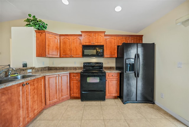 kitchen featuring black appliances, lofted ceiling, sink, and light tile patterned floors