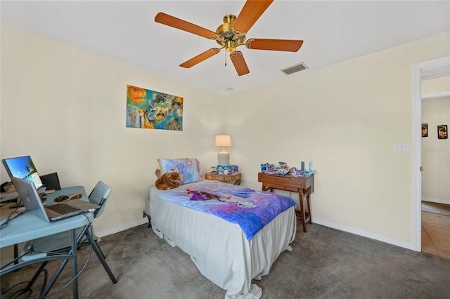 bedroom featuring dark colored carpet and ceiling fan