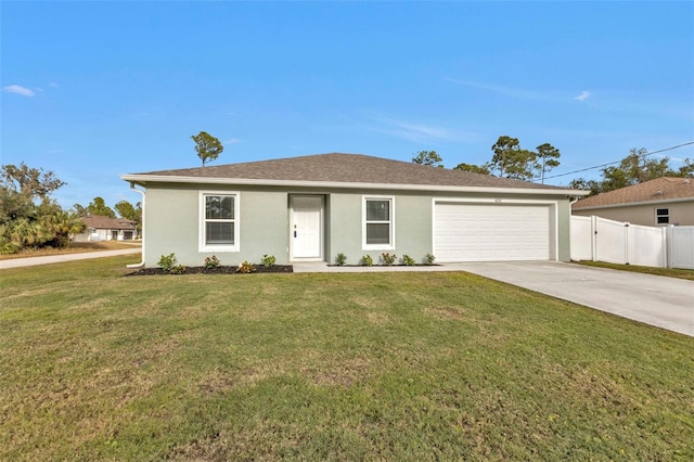 single story home with a garage and a front lawn