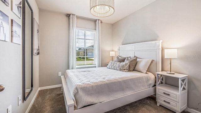 bedroom featuring dark colored carpet