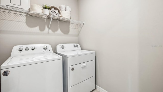 clothes washing area with independent washer and dryer