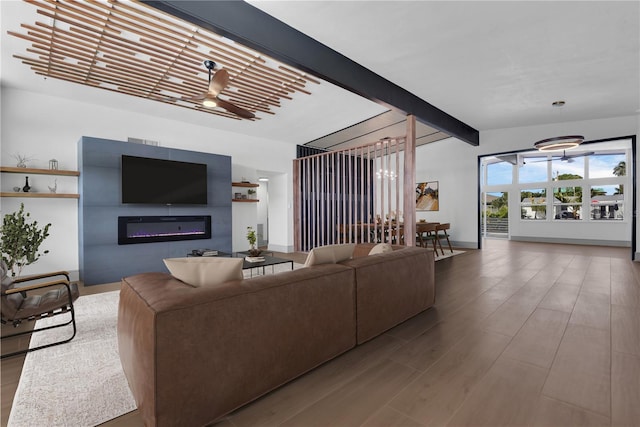 living room with hardwood / wood-style floors, ceiling fan, and lofted ceiling with beams