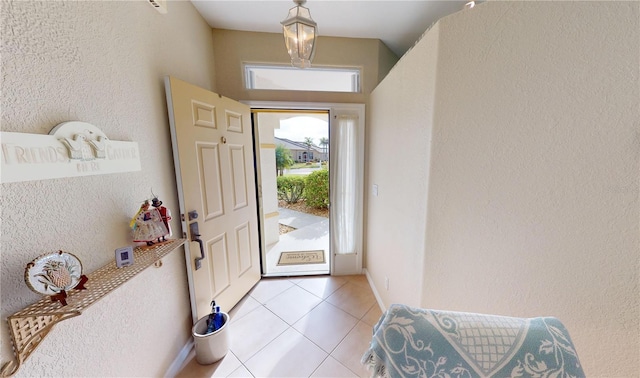 entryway with light tile patterned floors