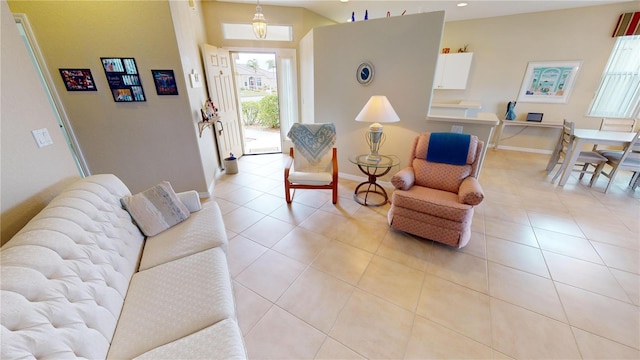 living room featuring light tile patterned floors and vaulted ceiling