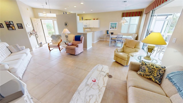 living room featuring light tile patterned floors and a wealth of natural light