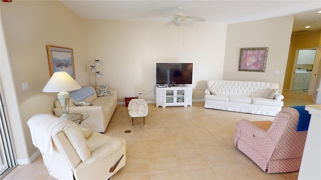 tiled living room featuring washer / clothes dryer and ceiling fan