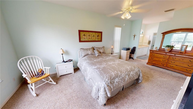 bedroom featuring carpet flooring, connected bathroom, and ceiling fan