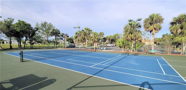 view of tennis court featuring basketball court