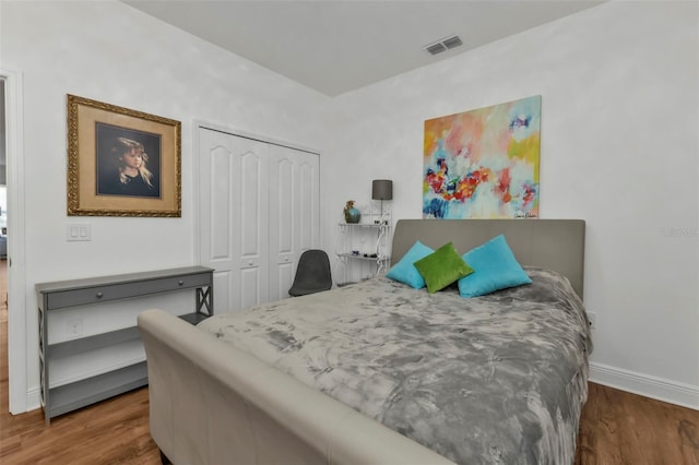 bedroom featuring a closet and wood-type flooring