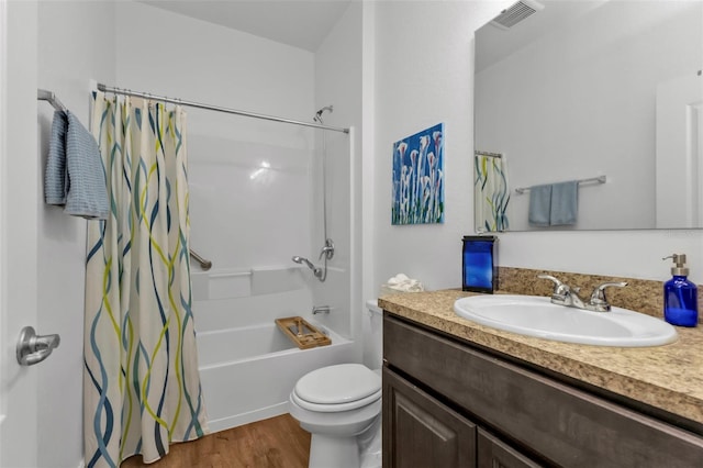 full bathroom featuring toilet, vanity, shower / bath combo, and hardwood / wood-style floors