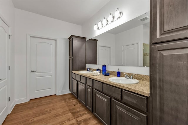 bathroom featuring hardwood / wood-style floors and vanity