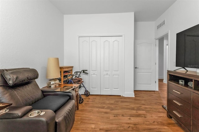 living area with light hardwood / wood-style floors