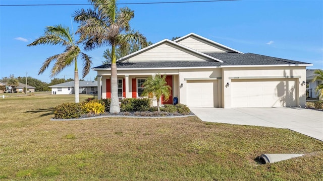 view of front facade with a front yard and a garage