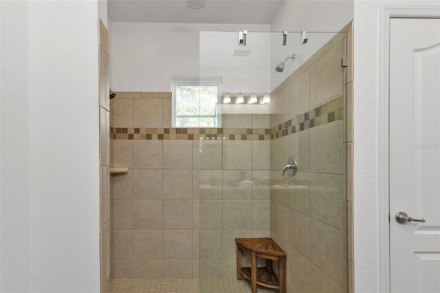 bathroom with tiled shower