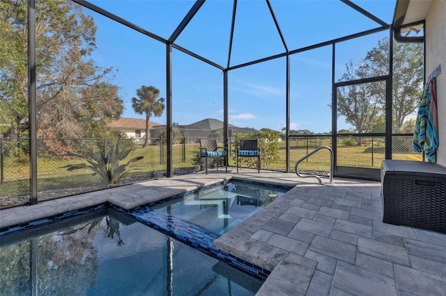 view of swimming pool featuring a yard, a lanai, and a patio