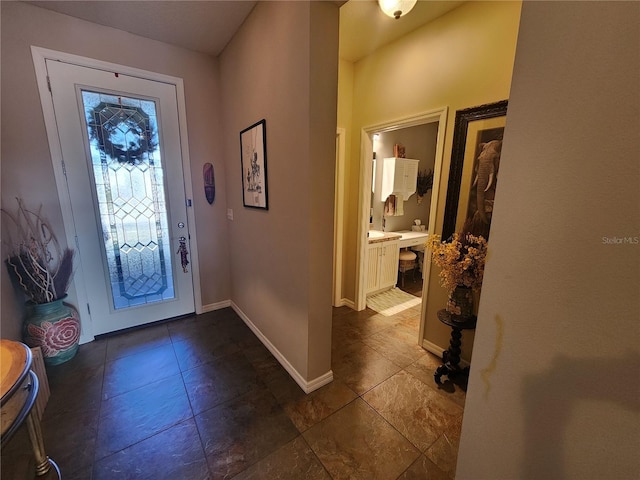 entrance foyer with dark tile patterned flooring