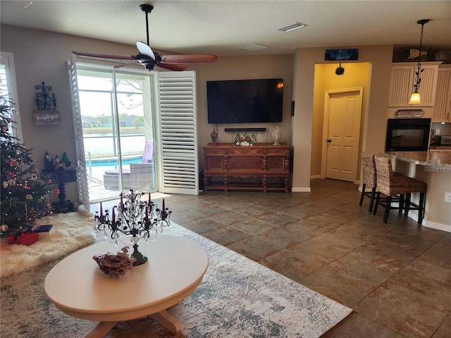 living room with ceiling fan