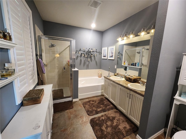 bathroom featuring separate shower and tub and vanity