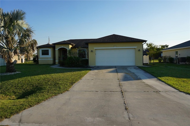 single story home with a front lawn and a garage