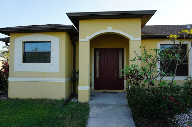 25115 Esmeralda Ct, Punta Gorda, FL 33955 - entrance to property featuring roof with shingles and stucco siding