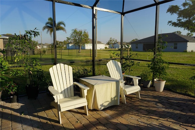 view of patio / terrace featuring glass enclosure