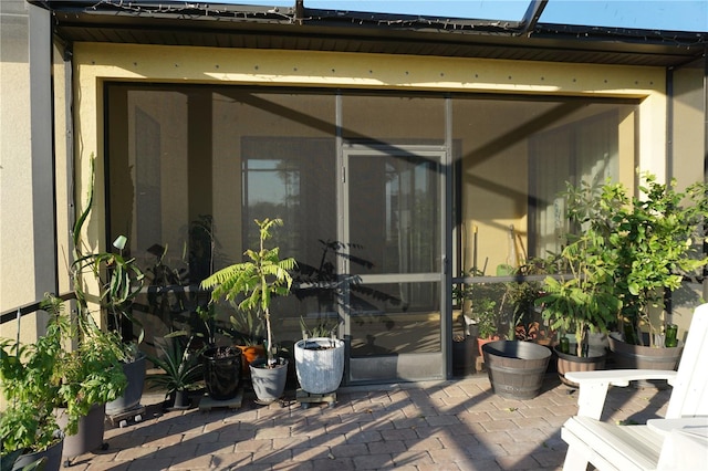 entrance to property featuring a patio area