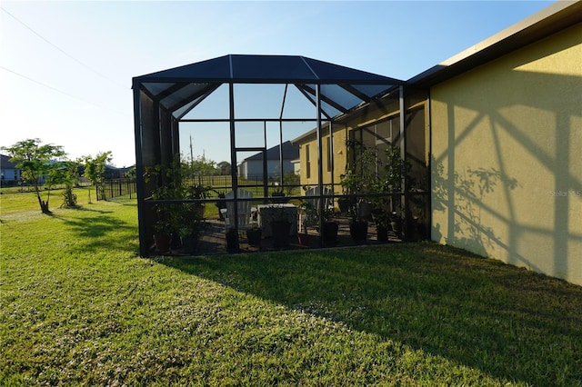 view of yard featuring glass enclosure