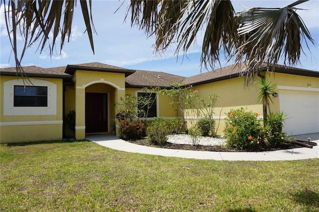 view of front facade with an attached garage, a shingled roof, a front lawn, and stucco siding