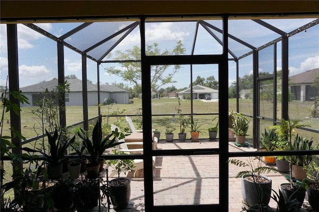 sunroom / solarium featuring a healthy amount of sunlight