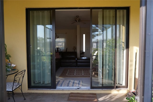 view of exterior entry featuring stucco siding