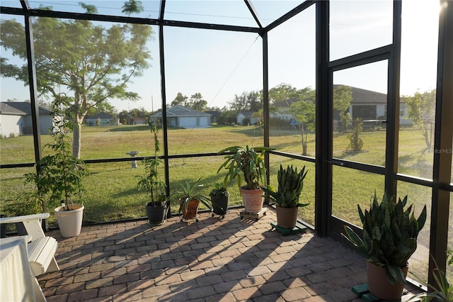 unfurnished sunroom with a residential view