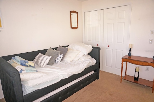 carpeted bedroom with a closet