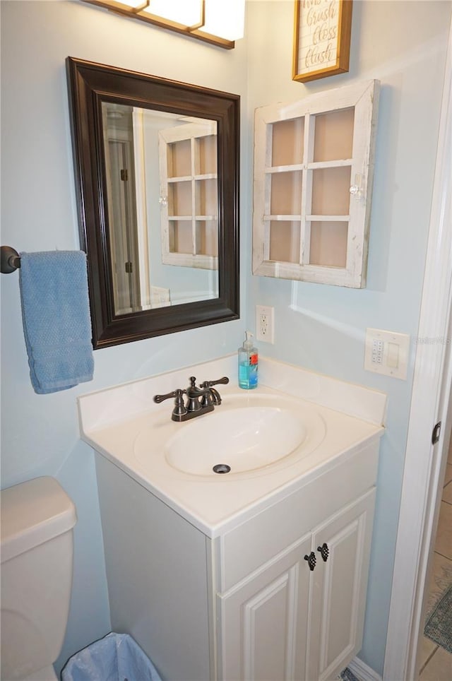 bathroom with vanity and toilet